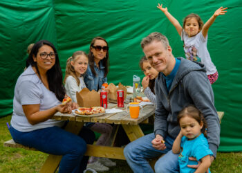 Family having a picnic and enjoying their day at Malahide Markets