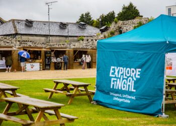 An Explore Fingal teal gazebo set up in Sowrds Castle grounds for the Explore Fingal Markets in Swords Castle.