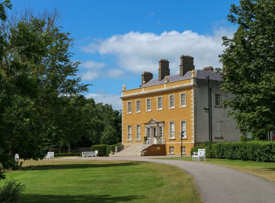 Newbridge House set against a bright blue sky