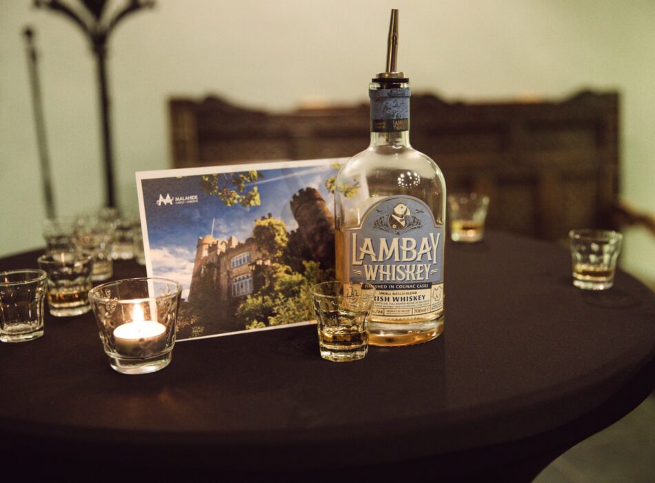 Lambay Island whiskey pictured with a tasting glass advertising.