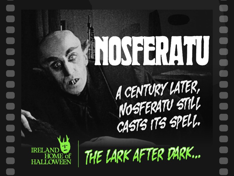 Event poster for a screening of the 1922 silent film Nosferatu as part of "The Lark After Dark" horror series. The poster features a film strip frame over a classic black-and-white image of Count Orlok looking forward with a menacing gaze. Prominent text reads "A CENTURY LATER, NOSFERATU STILL CASTS ITS SPELL," and a green logo in the bottom corner marks it as part of "Ireland Home of Halloween."